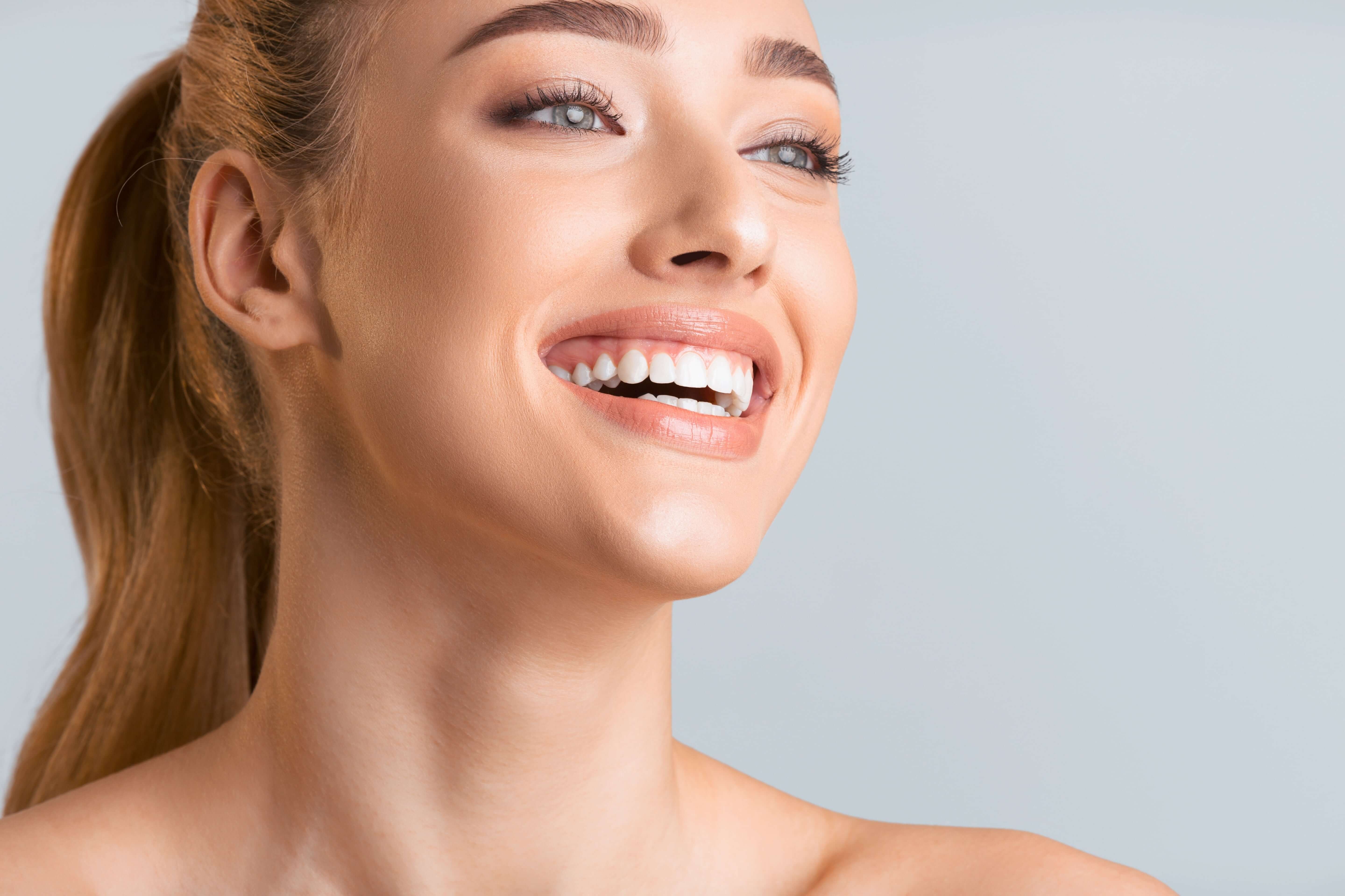 Close-up of LaserGlow PAP+ teeth whitening powder being used at home to remove coffee and wine stains.