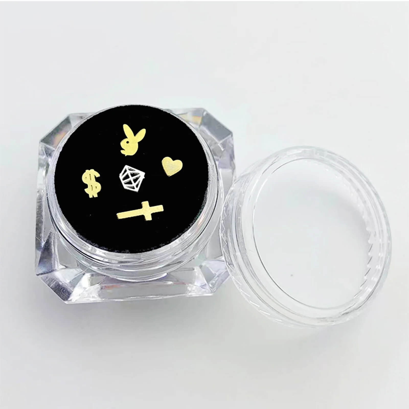 Clear acrylic display box with velvet cushion showcasing assorted LaserGlow butterfly, heart.