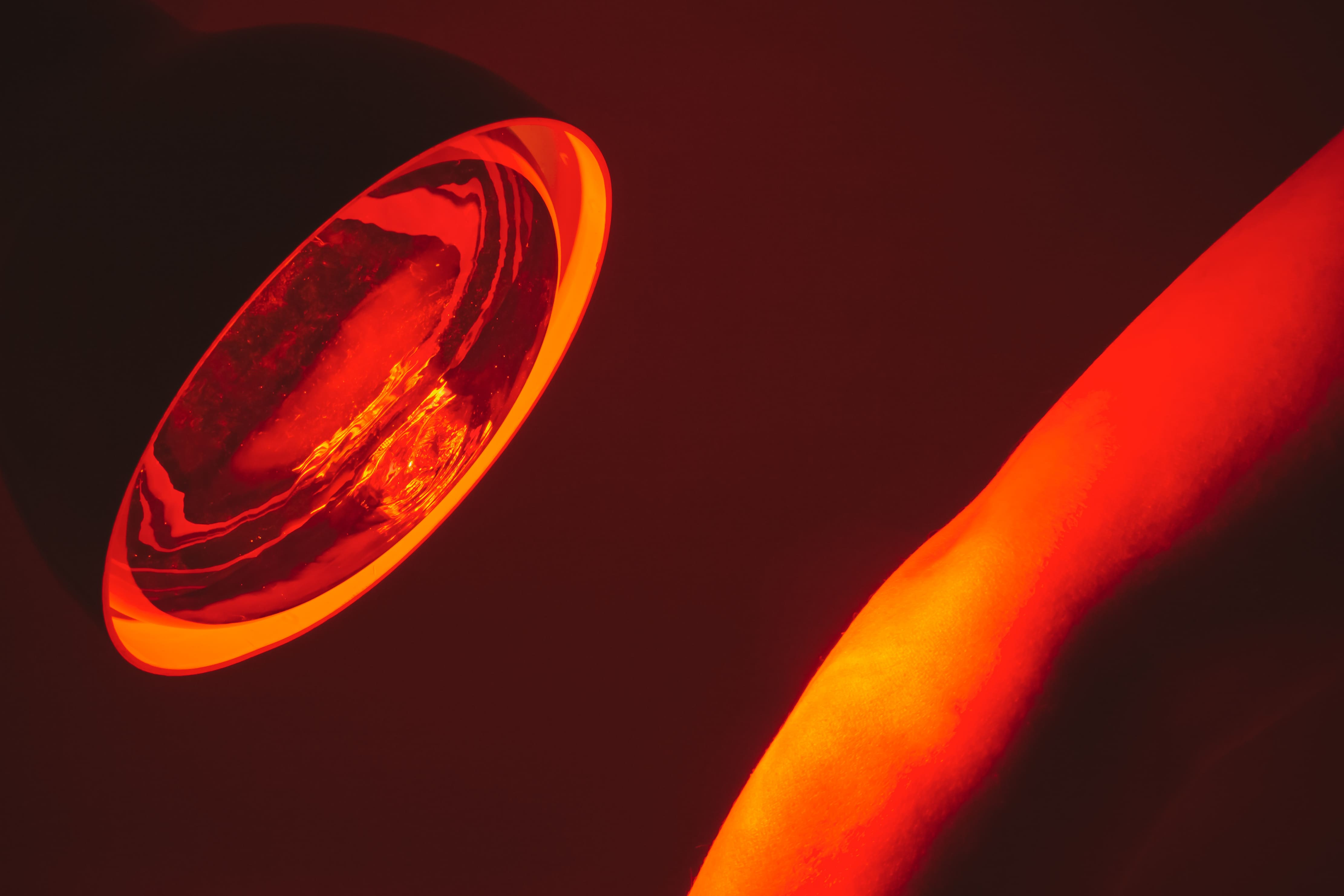 A person using the Laserglow cold sore red light therapy device on their lip to relieve pain and reduce inflammation