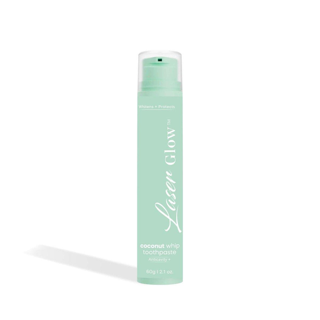 LaserGlow Coconut Whip Toothpaste in a mint green pump bottle, labeled as anticavity and whitening formula with 60g (2.1 oz) packaging