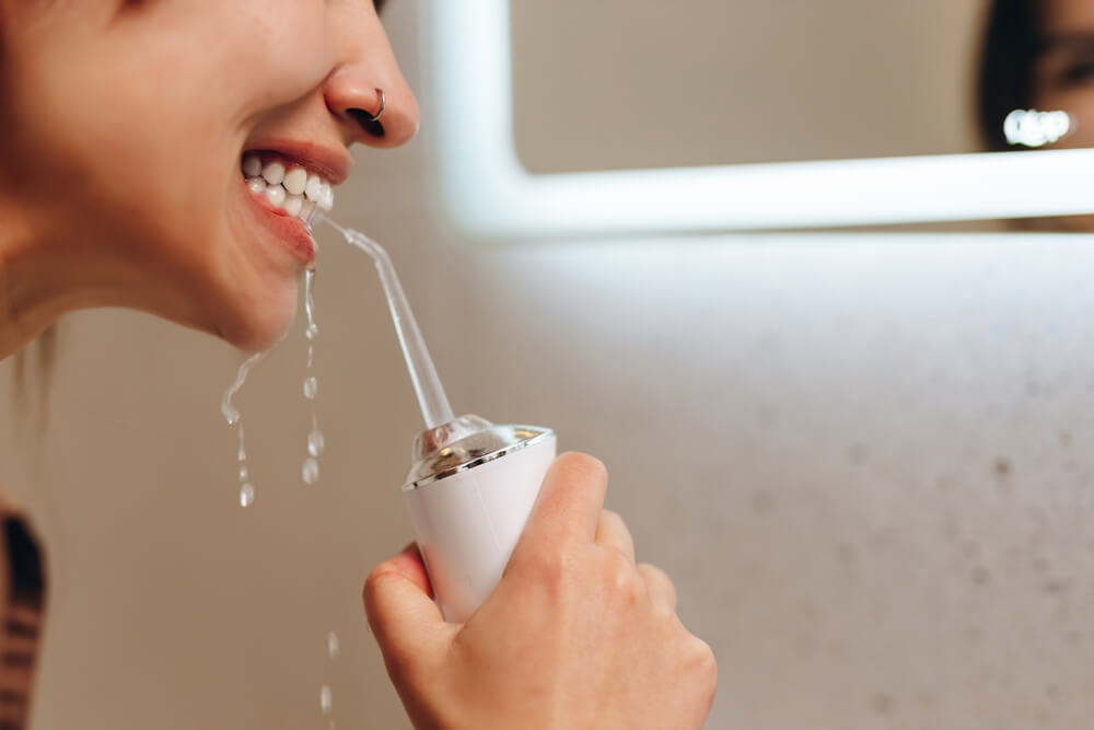 LaserGlow rechargeable cordless water flosser featuring long-lasting battery life and powerful water jets for optimal oral hygiene.
