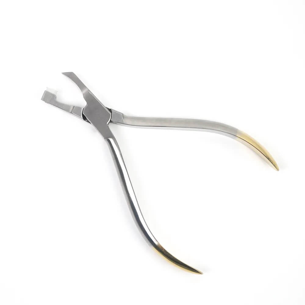 Beauty technician gently popping off a crystal tooth gem using the LaserGlow removal tool for safe.