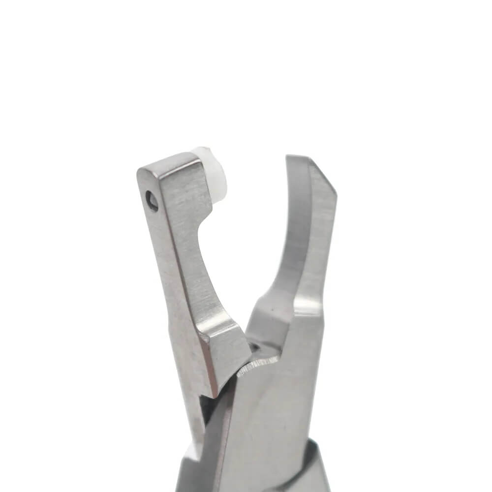 Detailed shot of angled plier tips on LaserGlow tool showing how they grip and lift tooth gems.