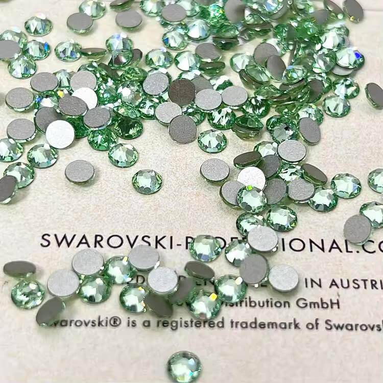 Bright green LaserGlow Swarovski Tooth Gem bringing a fresh, vibrant pop of color.