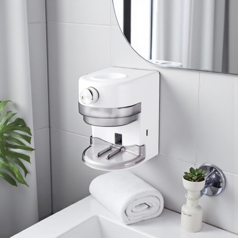 LaserGlow automatic toothpaste dispenser mounted on a bathroom wall.