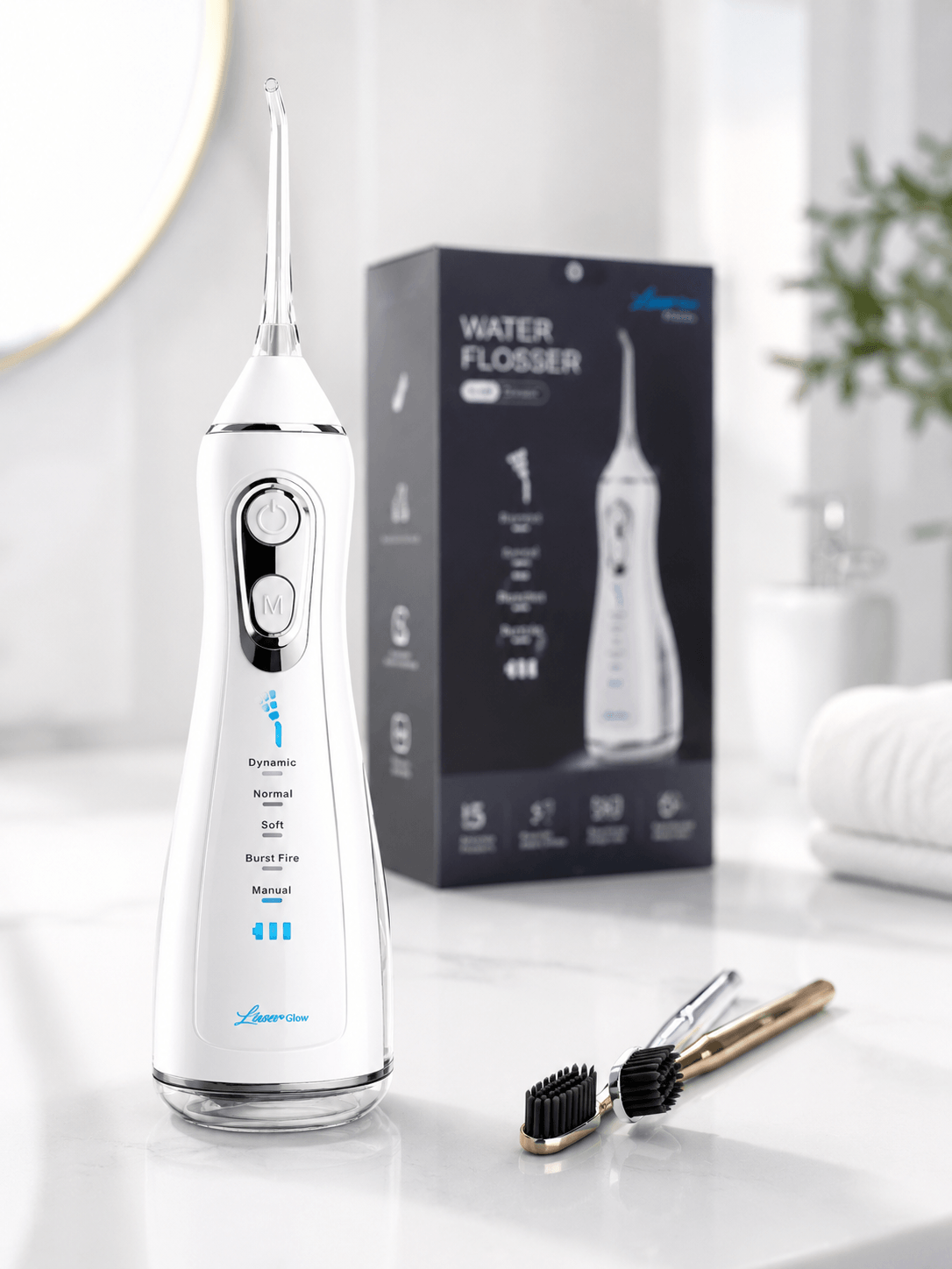LaserGlow white cordless water flosser with product box on a clean bathroom counter for Shopify gallery image