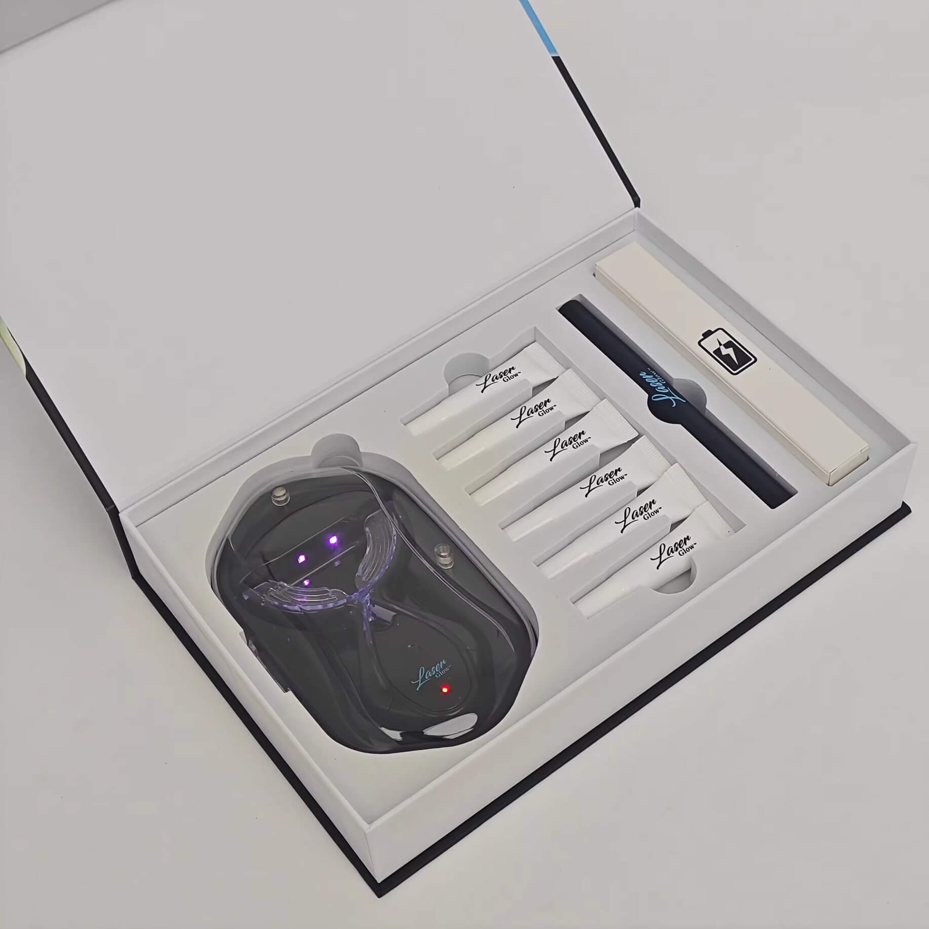 LaserGlow wireless rechargeable LED teeth whitening kit shown with trays and gel, delivering professional results with visible before-and-after whitening effects