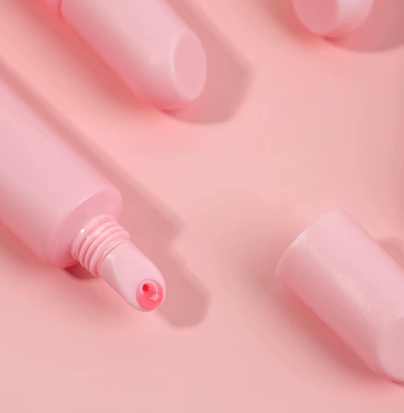 Close-up of LaserGlow Polypeptide Lip Repair Oil bottle showcasing luxury packaging and clinically formulated lip care with HA5, Arnica, Vitamin E, and Shea Butter