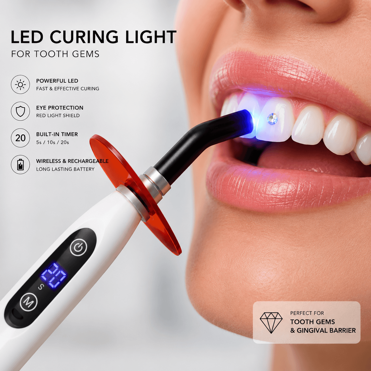 LED curing light being used to cure a tooth gem with red eye shield, built-in timer, and rechargeable design for tooth gems and gingival barrier