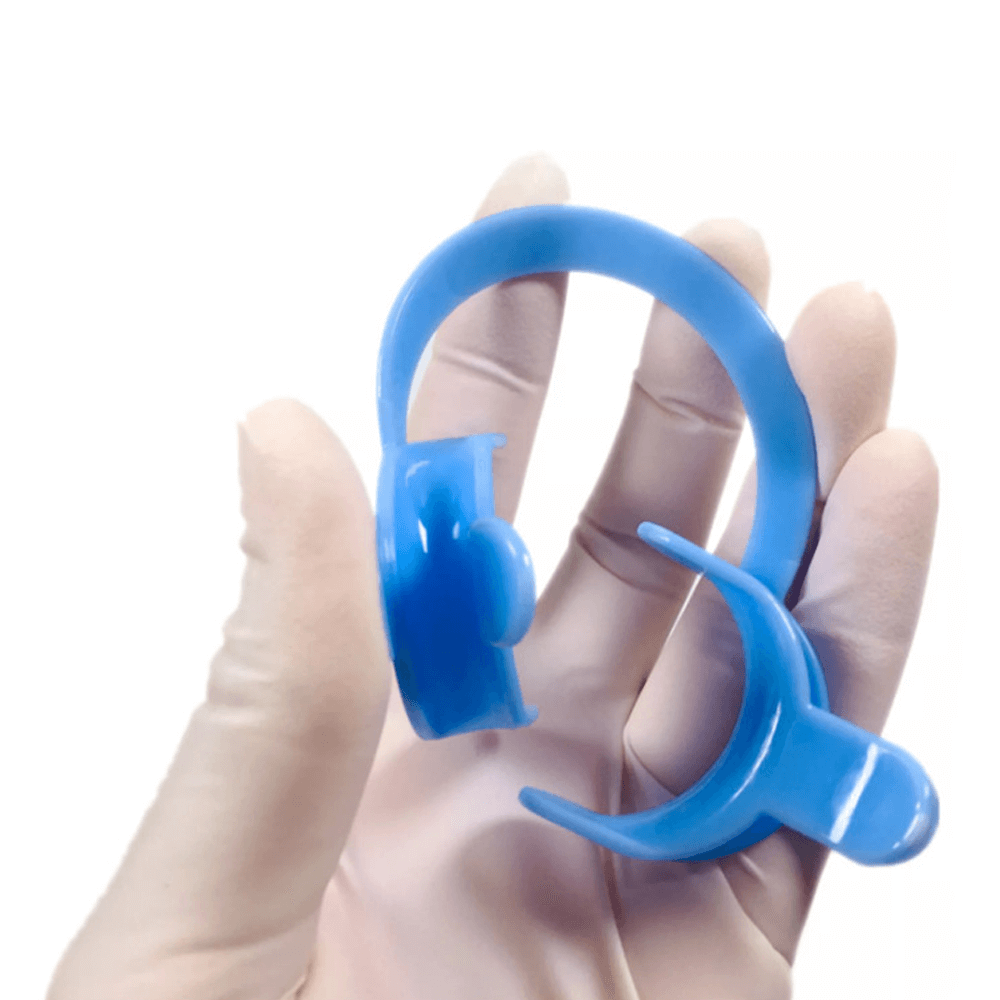 Close-up of flexible TPU cheek retractor with rounded comfort edges, latex-free