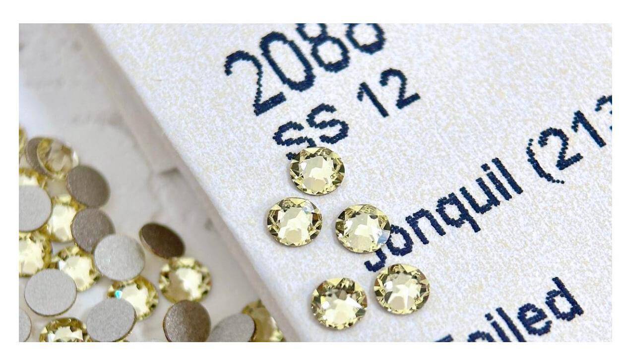 Vibrant yellow LaserGlow Swarovski Tooth Gem adding a playful, eye-catching accent