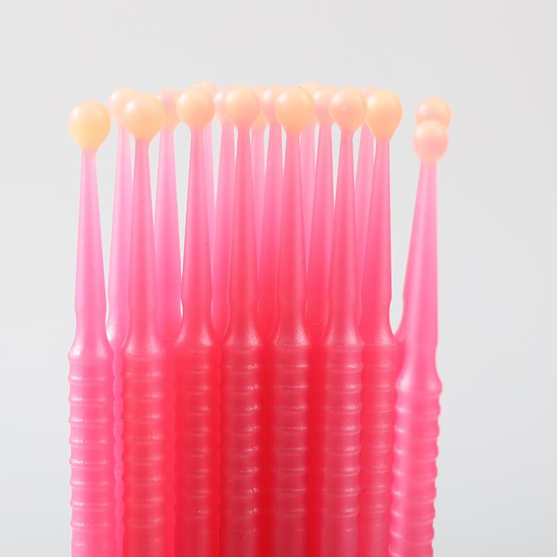 Professional wax applicator by LaserGlow for secure tooth gem application.